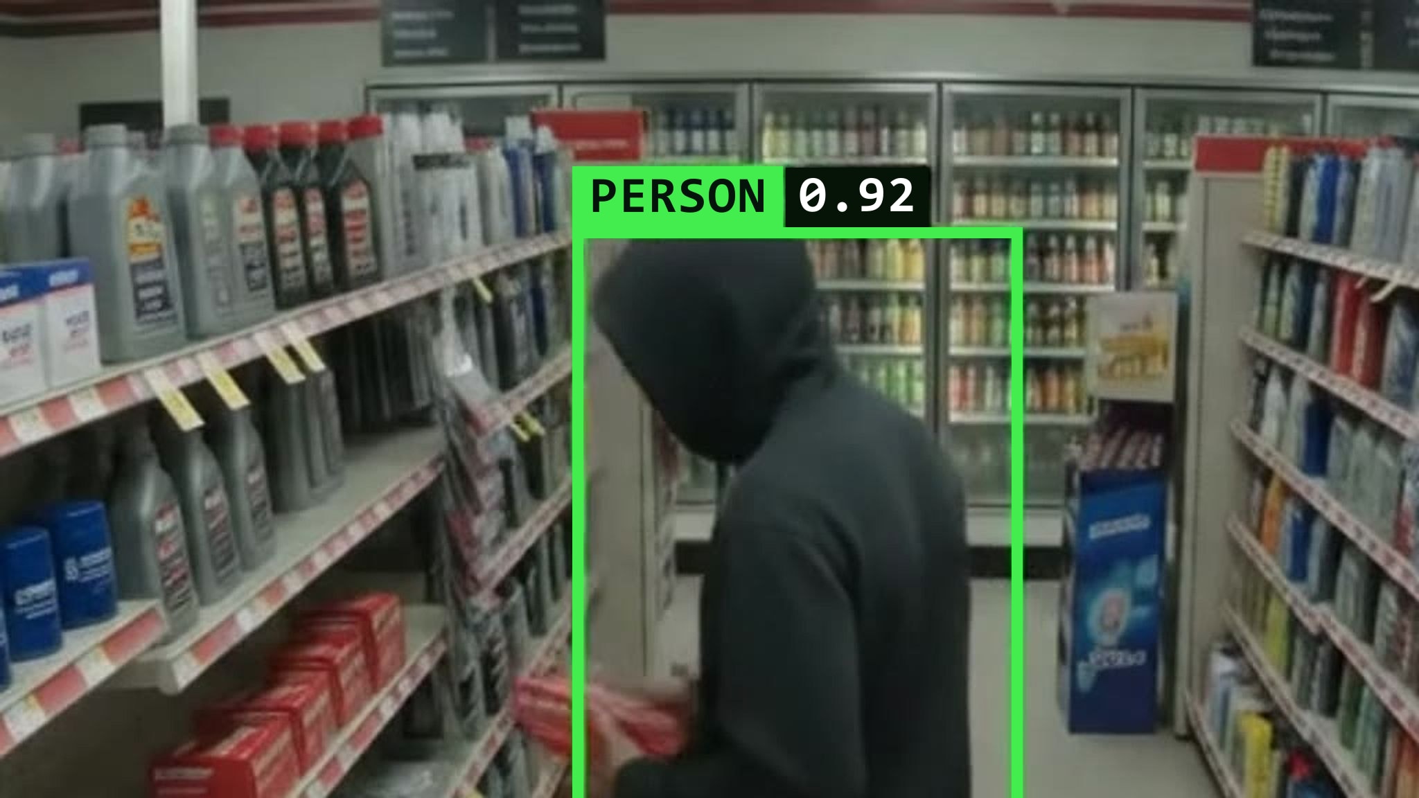Nexovia tracking a person of interest across a retail aisle with a PERSON 0.92 detection box