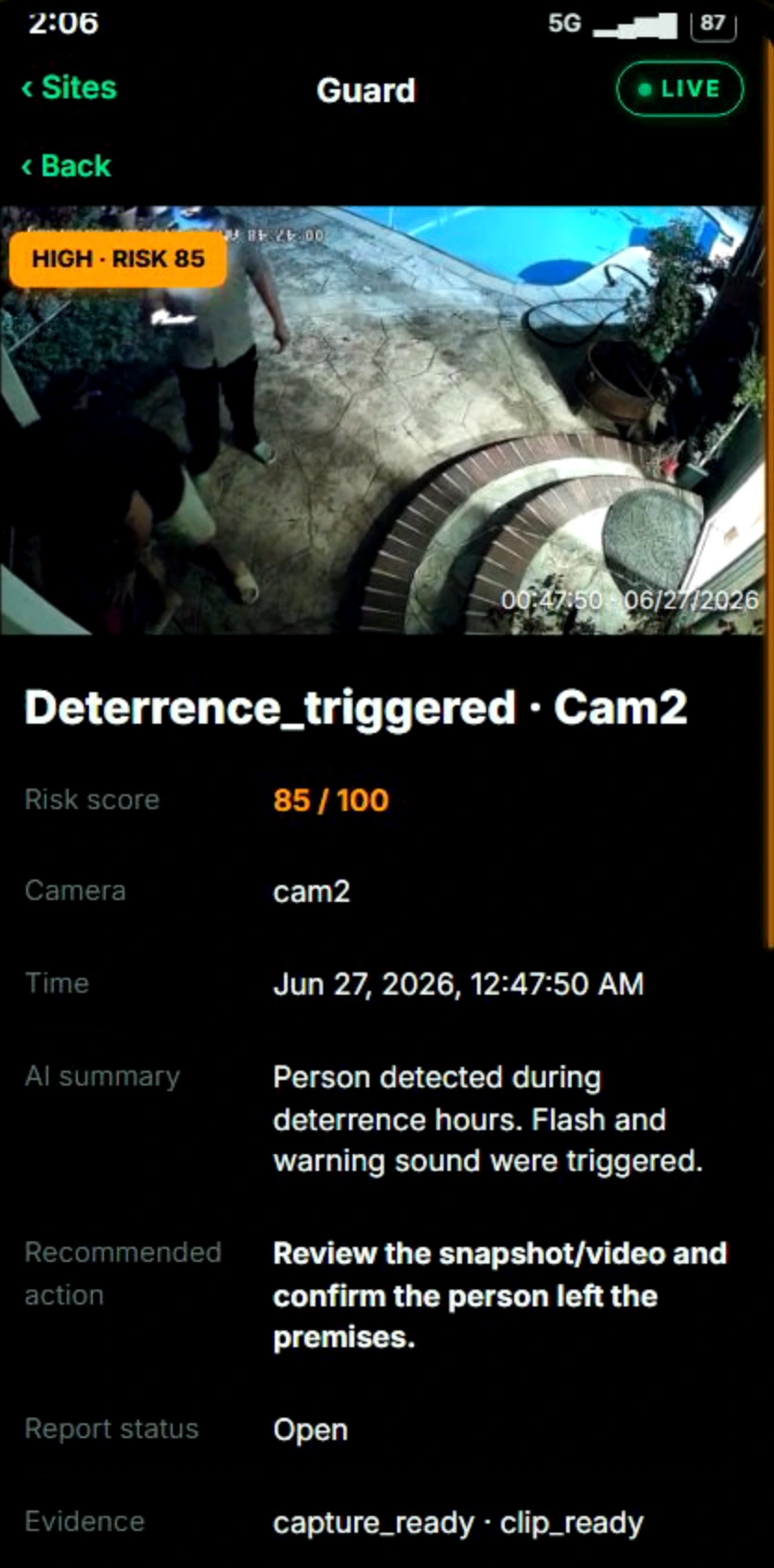 The Nexovia app after a deterrent fired — the incident card for Deterrence_triggered on Cam2, risk 85 of 100, showing the night capture of two people in the yard, the AI summary, the recommended action and the owner already notified